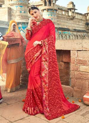 Adorn The Pretty Angelic Look Wearing This Designer Saree In Red Color Paired With Red Colored Blouse. This Saree Is Fabricated On Silk Georgette With Embroiderey Paired With Printed Art Silk Fabricated Blouse. 