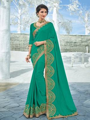 Presenting this Sea green color silk fabrics saree. Ideal for party, festive & social gatherings. this gorgeous saree featuring a beautiful mix of designs. Its attractive color and designer heavy embroidered design, designer heavy blouse, beautiful floral design work over the attire & contrast hemline adds to the look. Comes along with a contrast unstitched blouse.
