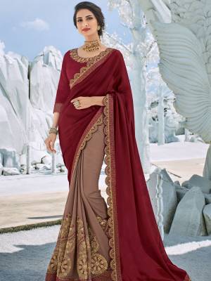 marvelously charming is what you will look at the next wedding gala wearing this beautiful maroon and Mauve color bright georgette and silk fabrics saree. Ideal for party, festive & social gatherings. this gorgeous saree featuring a beautiful mix of designs. Its attractive color and designer heavy embroidered design, Flower zari design, stone work, gota design, heavy designer blouse, beautiful floral design work over the attire & contrast hemline adds to the look. Comes along with a contrast unstitched blouse.
