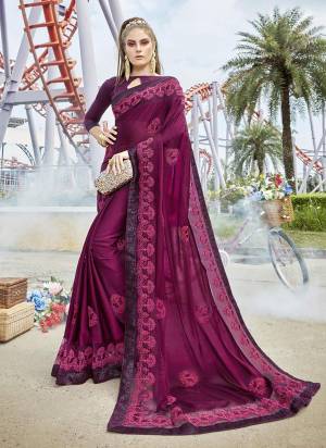 A Must Have Shade In Every Womens Wardrobe Is Here With This Designer Saree In Wine Color Paired With Wine Colored Blouse. This Saree Is Satin Silk Based Paired With Art Silk Blouse. 