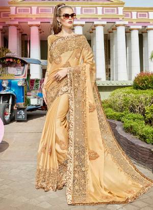 Enhance Your Personality Wearing This Designer Saree In Beige Color Paired With Beige Colored Blouse. This Saree Is Fabricated On Satin Silk Paired With Art Silk Fabricated Blouse. 