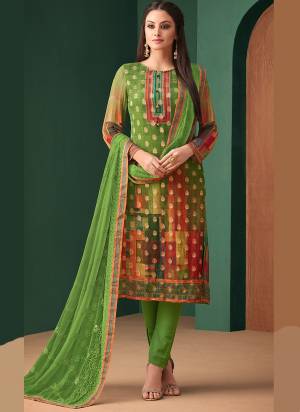 This Festive Season, Get A Traditional Look Wearing This Designer Straight Suit In Parrot Green Color. Its Top Is Fabricated On Jacquard Georgette Paired With Santoon Bottom And Chiffon Dupatta. All Its Fabrics Ensures Superb Comfort All Day Long. 