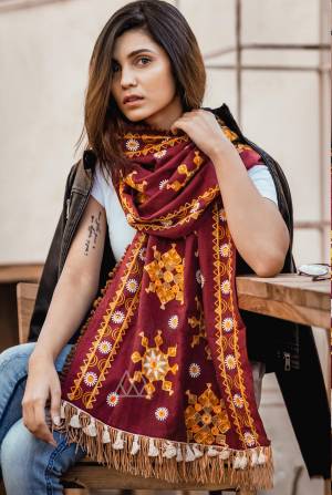 Adopt The Seasons Fashion With This Khadi Fabricated Beautiful Scarf Beautified with Multi Colored Woollen Thread Embroidery. It Can Be Paired With Simple Kurti Or Even Western Tops.