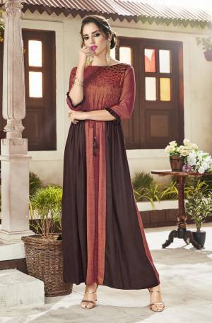 Grab This Beautiful Designer Readymade Kurti In Rust And Brown Color Fabricated On Viscose Rayon Beautified With  Embroidery. Its Unique Color Pallete Will Earn You Lots Of Compliments From Onlookers. 