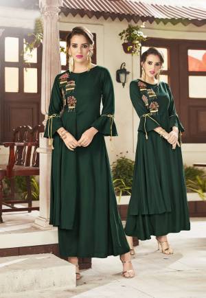 Add This Lovely Designer Readymade Kurti To Your Wardrobe In Dark Green Color Fabricated On Viscose Rayon. It Has Elegant And Attractive Embroidery Which Will Earn You Lots Of Compliments From Onlookers. 