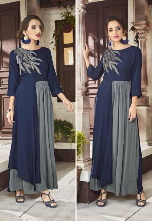 Here Is A New And Unique Patterned Designer Readymade Kurti In Navy Blue And Grey Color Fabricated On Viscose Rayon. This Kurti Is Beautified With Pretty Embroidery Over The Yoke. Buy Now.