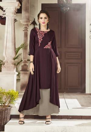 You Will Definitely Earn Lots Of Compliments Wearing This Designer Readymade Kurti In Wine And Grey Color Fabricated On Viscose Rayon. This Kurti Is Light Weight And Easy To Carry All Day Long. 