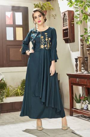 New Shade Is Here To Add Into Your Wardrobe With This Designer Readymade Kurti In Teal Blue Color Fabricated On Viscose Rayon. It Has Yoke Embroidery With Double Layered Pattern. 