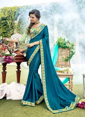 Look Beautiful In This Pretty Color Pallete Wearing This Designer Saree In Blue Color Paired With Contrasting Pastel Green Colored Blouse. This Saree Is Satin Georgette Based Paired With Art Silk Fabricated Blouse. Its Complimenting Colors Will Earn you Lots Of Compliments From Onlookers. 