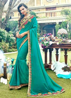 Go With The Shades Of Green With This Designer Saree In Sea Green Color Paired With Dark Green Colored Blouse. This Saree Is Fabricated On Satin Georgette Paired With Art Silk Fabricated Blouse. Buy Now.