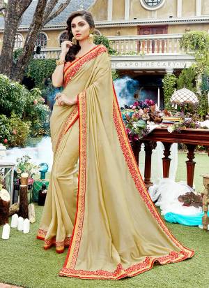 Simple And Elegant Looking Designer Saree In Here In Beige Color Paired With Red Colored Blouse. This Saree Is Fabricated On Satin Georgette Paired With Art Silk fabricated Blouse. It Is Light Weight And Easy To Carry Throughout The Gala.