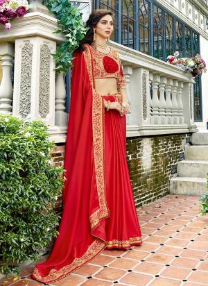 Adorn The Pretty Angelic Look wearing This Designer Saree In Red Color Paired With Beige Colored Blouse. This Saree Is Fabricated On Satin Georgette Paired With Art Silk Fabricated Blouse. Buy Now.