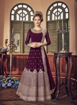 A Must Have Shade In Dark Is Here With This Heavy Designer Floor Length Suit In Magenta Pink Color Paired With Magenta Pink Colored Bottom And Dupatta. Its Long Heavy Top Is Georgette Based Paired With Santoon Bottom And Chiffon Dupatta. It Has Heavy Jari Embroidery Giving A Rich And Elegant Look To The Suit.