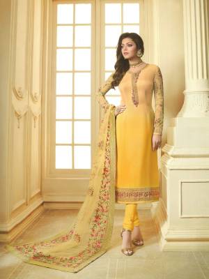 Celebrate This Festive Season With Ease And Comfort Wearing This Designer Straight Suit In Yellow Color. Its Top Is Georgette Satin Fabricated Paired With Santoon Bottom And Net Fabricated Embroidered Dupatta. 