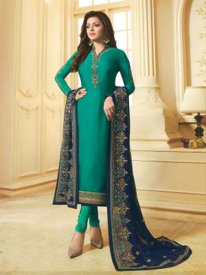 Here Is a Pretty Shade With  Designer Straight Suit In Teal Blue Color Paired With Navy Blue Colored Dupatta. Its Top Is Georgette Satin Fabricated Paired With Santoon Bottom And Net Dupatta. Buy Now.