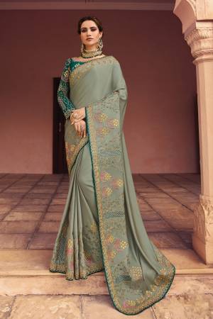 You Will Definitely Earn Lots Of Compliments Wearing This Designer Saree In Pastel Mint Green Color Paired With Teal Green Colored Blouse. This Saree And Blouse Are Silk Beautified With Pretty Attractive Embroidery Over The Blouse And Saree. 