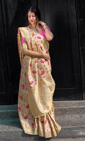 Simple And Elegant Looking Designer Silk Saree Is Here In Cream Color Paired With Pink Colored Blouse. This Saree And Blouse Are Fabricated On Kanjivaram Art Silk Beautified With Weave All Over . 