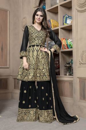 Here Is A Designer Sharara Dress In Black For This Wedding And Festive Season.Its Top And Bottom Are Georgette Based Paired With Chiffon Fabricated Dupatta. Both Its Top And Bottom Are Beautified With Heavy Jari Embroidery And Stone Work. Buy This Semi-Stitched Suit Now.