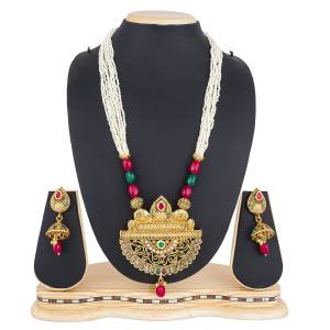 Add This Pretty Heavy Necklace Set In Golden Color. This Lovely Set Comes A Pair Of Earrings . It Can Be Paired With Any Colored Traditional Attire. Buy Now.
