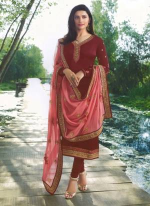 Attract All In This Beautiful Designer Straight Suit In Maroon Color Paired With Pink Colored Dupatta. Its Top Is Georgette Satin Based Paired With Santoon Bottom And Georgette Dupatta. 