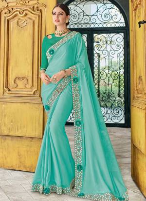 Gorgeously mesmerizing is what you will look at the next wedding gala wearing this beautiful Aqua Blue color two tone bright georgette saree. Ideal for party, festive & social gatherings. this gorgeous saree featuring a beautiful mix of designs. Its attractive color and designer heavy embroidered design, Flower patch design, stone design, beautiful floral design work over the attire & contrast hemline adds to the look. Comes along with a contrast unstitched blouse.