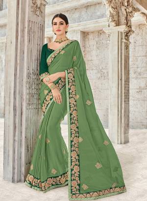 Get this amazing saree and look pretty like never before. wearing this green color bright georgette saree. Ideal for party, festive & social gatherings. this gorgeous saree featuring a beautiful mix of designs. Its attractive color and designer heavy embroidered design, stone design, beautiful floral design work over the attire & contrast hemline adds to the look. Comes along with a contrast unstitched blouse.