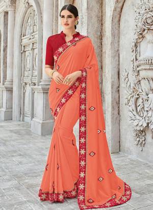 Flaunt your gorgeous look wearing this orange color silk fabrics saree. Ideal for party, festive & social gatherings. this gorgeous saree featuring a beautiful mix of designs. Its attractive color and designer heavy embroidered design, designer heavy embroidered blouse, beautiful floral design work over the attire & contrast hemline adds to the look. Comes along with a contrast unstitched blouse.
