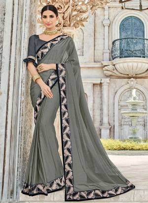 Wear this grey color two tone chiffon pattern saree. Ideal for party, festive & social gatherings. this gorgeous saree featuring a beautiful mix of designs. Its attractive color and designer heavy embroidered design, Flower patch design, stone design, beautiful floral design work over the attire & contrast hemline adds to the look. Comes along with a contrast unstitched blouse.