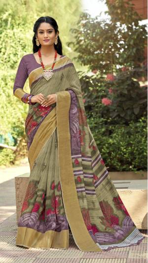 This Festive Season Look Pretty And Elegant With This Saree In Mint Green And Purple Color Paired With Purple Colored Blouse. This Saree And Blouse Are Fabricated On Cotton Silk Beautified With Prints All Over It. It Is Light In Weight Which Also Ensures a Superb Comfort To Enjoy The Fest. Buy Now.