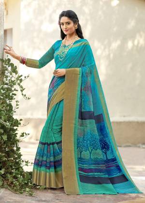 For Your Casual Or Semi-Casual Wear, Grab This Pretty Saree In Blue Paired With Blue Colored Blouse. This Lovely Saree And Blouse Are Fabricated On Cotton Silk Beautified With Prints All Over It. It Is Easy To Drape And Also Durable. 