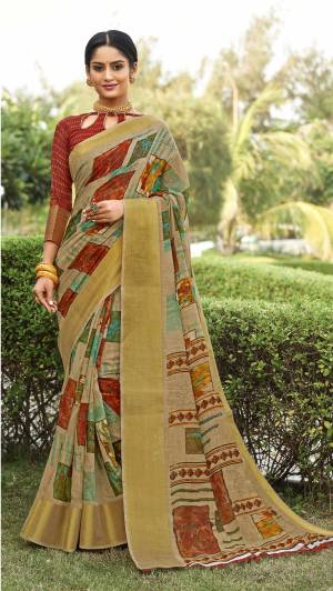 This Festive Season Look Pretty And Elegant With This Saree In Beige Color Paired With Rust Colored Blouse. This Saree And Blouse Are Fabricated On Cotton Silk Beautified With Prints All Over It. It Is Light In Weight Which Also Ensures a Superb Comfort To Enjoy The Fest. Buy Now.