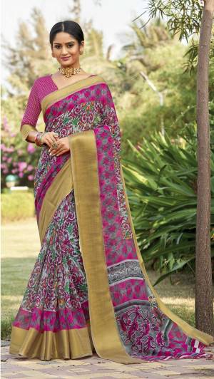 For Your Casual Or Semi-Casual Wear, Grab This Pretty Saree In Rani Pink Paired With Rani Pink Colored Blouse. This Lovely Saree And Blouse Are Fabricated On Cotton Silk Beautified With Prints All Over It. It Is Easy To Drape And Also Durable. 