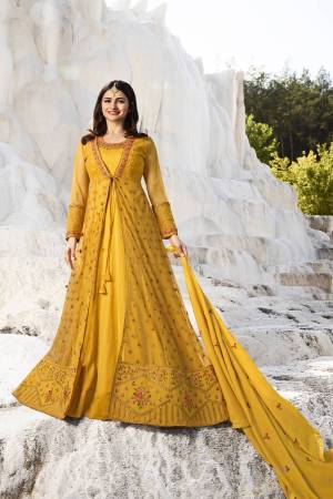 Celebrate This Festive Season Wearing This Heavy Designer Indo Western Suit In Yellow Color. Its Top Is Net And Silk Based Paired With Santoon Bottom And Georgette Dupatta. All Its Fabric Ensures Superb Comfort Throughout The Gala.