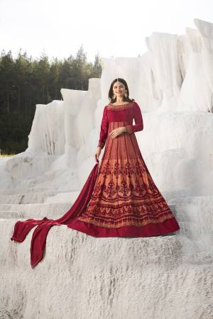 Flaunt Your Rich Taste With This Royal Looking Designer Floor Length Suit In Maroon And Peach Color Paired With Peach Colored Bottom And Maroon Dupatta. Its Top Is Net And Silk Based Paired With Santoon Bottom And Georgette Dupatta. 