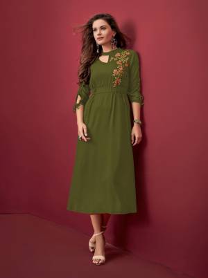 Trending Color Of The Season Is Here With This Designer Readymade Kurti In Olive Green Color Fabricated On Rayon. It Has Lovely Patterned Sleeves With Embroidered Yoke.