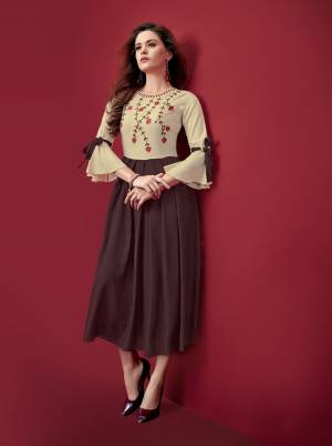 Simple And Elegant Looking Designer Readymade Kurti Is Here In Brown And Cream Color Fabricated On Rayon. Its Fabric Is Soft Towards Skin And Easy To Carry All Day Long.