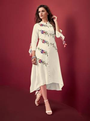 Add This Lovely Designer Readymade Kurti In White Color Fabricated On Rayon. It Is Light In Weight, Easy To Carry And Durable. 