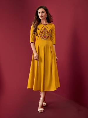 For Your Semi-Casuals, Grab This Pretty Readymade Kurti In Yellow Color Fabricated On Rayon. It Is Beautified With Resham Work. Buy Now.