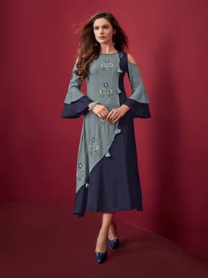 Pretty Shades Of Blue Are Here With This Designer Readymade Kurti In Navy Blue And Light Blue color Fabricated On Rayon. It Is Available In All Regular Sizes. Buy Now.