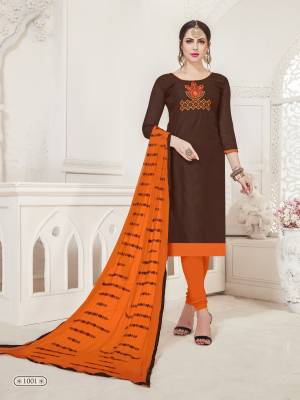Here Is A Beautiful Dress Material For Your Casual Wear In Brown Colored Top Paired With Contrasting Orange Colored Bottom And Dupatta.Its Top Is Fabricated On Art Silk Paired With Cotton Bottom And Chiffon Dupatta. It Is Beautified With Thread Work Over The Dupatta And Top. 