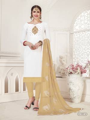 Simple And Elegant Looking Dress Material Is Here In White Colored Top Paired With Beige Colored Bottom And Dupatta. Its Top Is Silk Based Paired With Cotton Bottom And Chiffon Dupatta. All Its Fabric Are Light Weight And Easy to Carry All Day Long. 