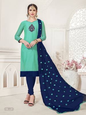 A Very Pretty Dress Material Is Here In Sea Green Colored Top Paired With Contrasting Navy Blue Colored Bottom And Dupatta. Its Top Is Art Silk Based Paired With Cotton Bottom And Chiffon Dupatta. Get This Dress Material Now.