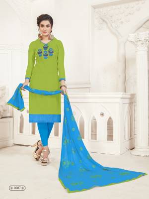 Pretty Bright Shade Is Here With This Dress Material In Parrot Green Color Paired With contrasting Sky Blue Colored Bottom And Dupatta, Its Top Is Fabricated On Art Silk Paired With Cotton Bottom And Chiffon Dupatta. 