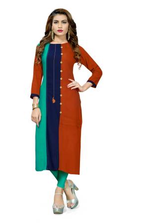For Your Casual Or Semi-Casual Wear, Grab This Readymade Kurti In Brown And Sea Green Color Fabricated On Rayon. It Is Beautified With Buttons And Also It Is Easy To Carry All Day Long. 