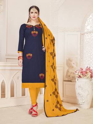 Enhance Your Beauty With This Pretty Dress Material In Navy Blue Colored Top Paired With Contrasting Musturd Yellow Colored Bottom And Dupatta. Get This Cotton Based Dress Material Stitched As Per Your Desired Fit And Comfort. 
