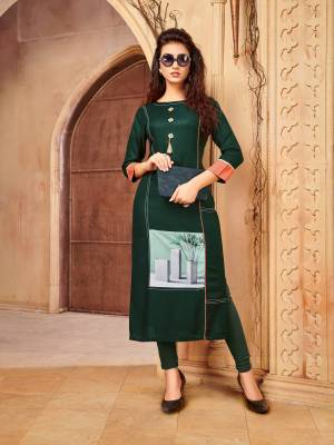 Add Some Casuals With This Pretty Kurti In Dark Green Color Fabricated On Rayon. It Is Available In All Regular Sizes Beautified With Printed Patch. 