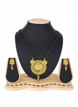Grab This Heavy Mangalsutra Set In Golden Color Which Comes With A Pair Of Earrings, Also It Can Be Paired With Colored Ethnic Attire. Buy Now.
