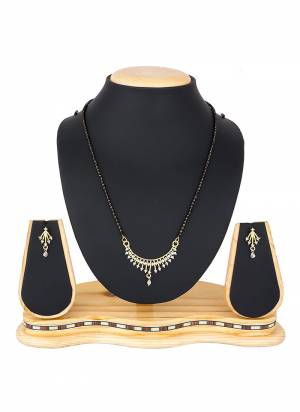 To Give An Elegant Look To Your Neckline, Grab This Pretty Elegant Looking Mangalsutra Set In Golden Color Beautified With Diamond Work All Over. It Can Be Paired With Any Colored Attire. Buy Now.