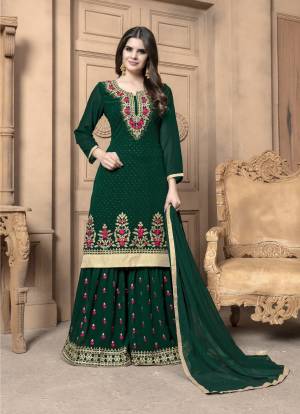 This Festive Season, Adorn A Lovely Look Wearing This Designer Sharara Suit In Pine Green Color. Its Top And Bottom Are Georgette Based Paired With Chiffon Dupatta. Its Top And Bottom Are Beautified With Heavy Embroidery. Buy Now.