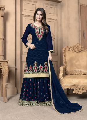 This Festive Season, Adorn A Lovely Look Wearing This Designer Sharara Suit In Navy Blue Color. Its Top And Bottom Are Georgette Based Paired With Chiffon Dupatta. Its Top And Bottom Are Beautified With Heavy Embroidery. Buy Now.